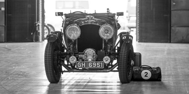 A front profile view of a heritage Bentley Blower in black and white | Bentley Motors