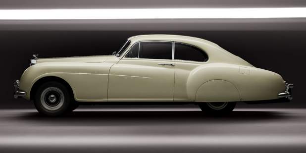A side profile shot of a pearl white iconic Bentley R-Type Continental | Bentley Motors