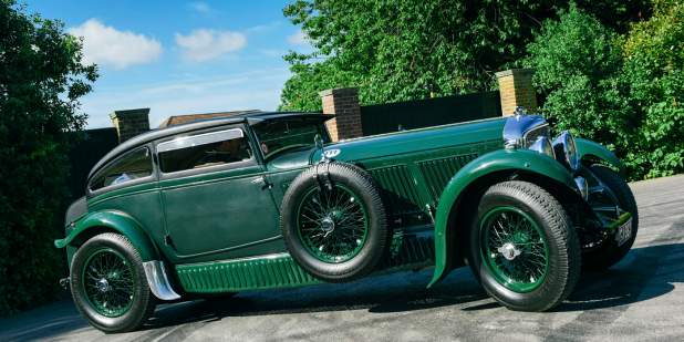 Dark green heritage Bentley Blue Train parked in a driveway | Bentley Motors